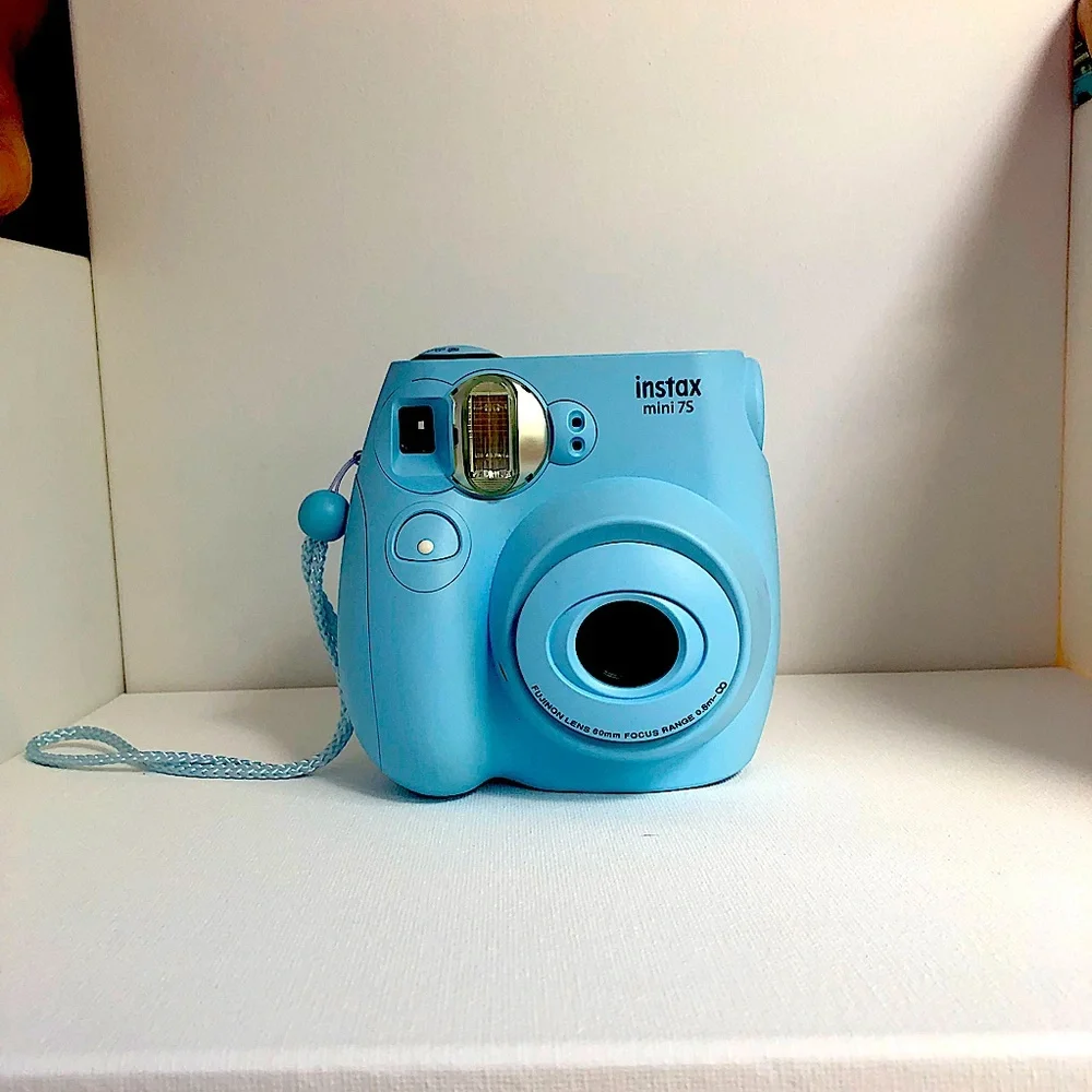 Blue instax mini 7s Polaroid camera