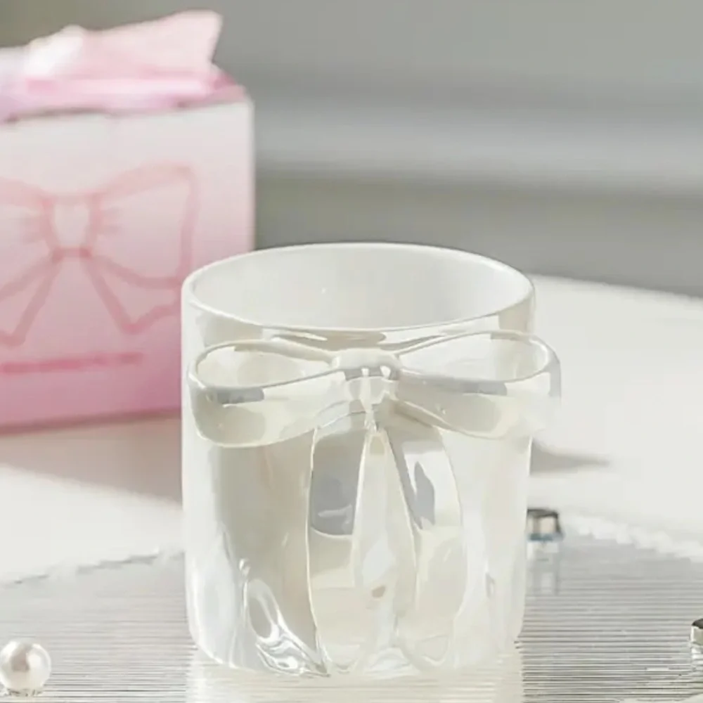 RIBBON HANDLE CUP NEW IN BEAUTIFUL PACKAGE. NIB PINK WHITE AND PURPLE AVAIL