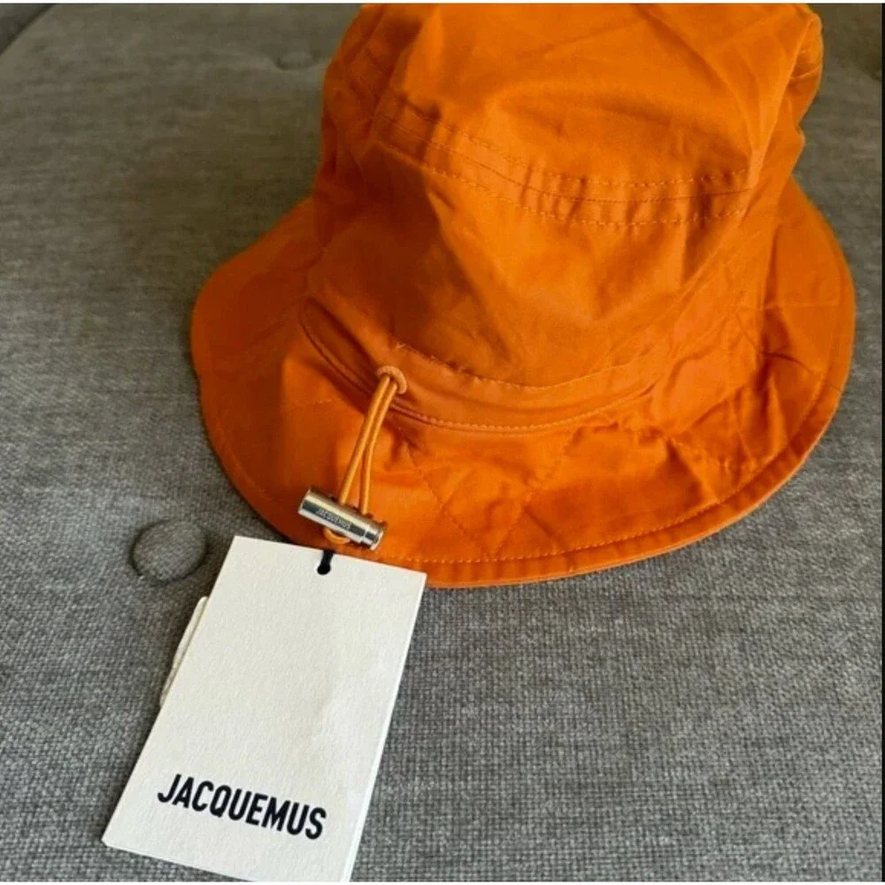 Jacquemus orange logo bucket hat seen on Hailey size56
