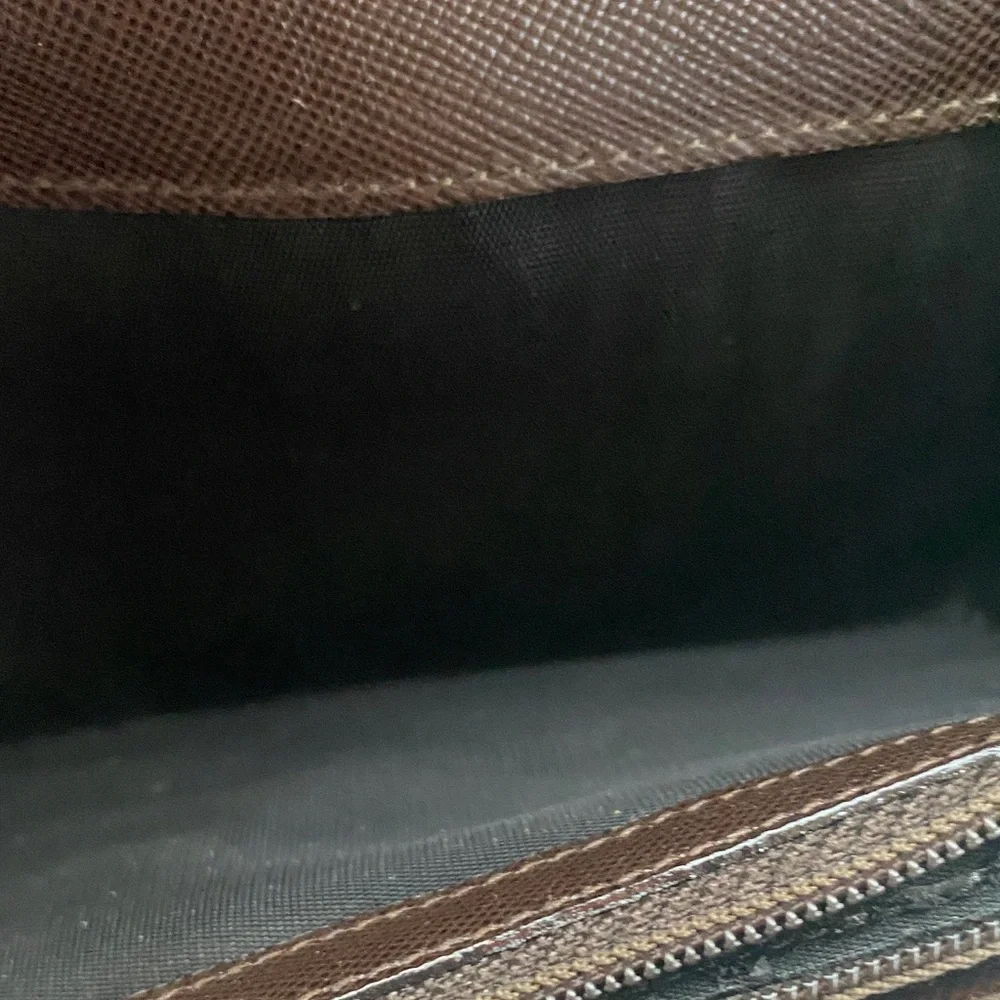 Salvatore Ferragamo Deep brown leather wallet with gold accent
