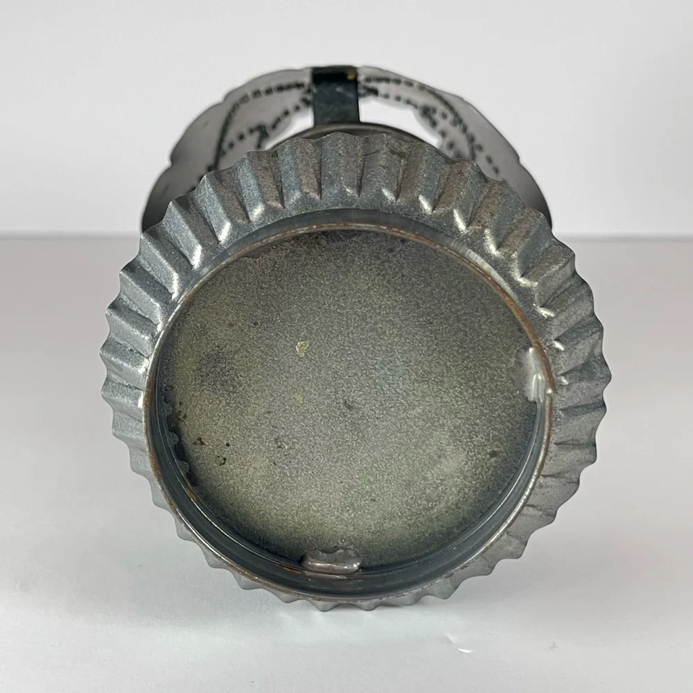Vintage punched tin tea light candle holder