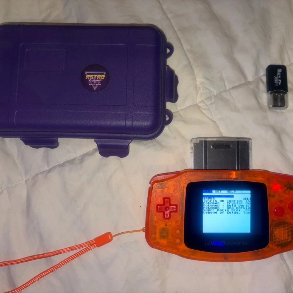 Nintendo Game Boy Advance in Translucent Orange with Purple Case