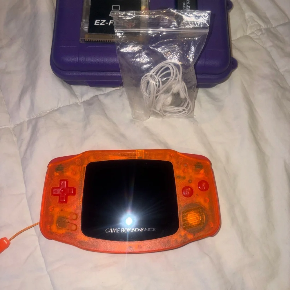 Nintendo Game Boy Advance in Translucent Orange with Purple Case