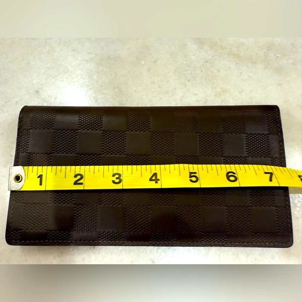 Louis Vuitton Brazza wallet in brown checkerboard print leather