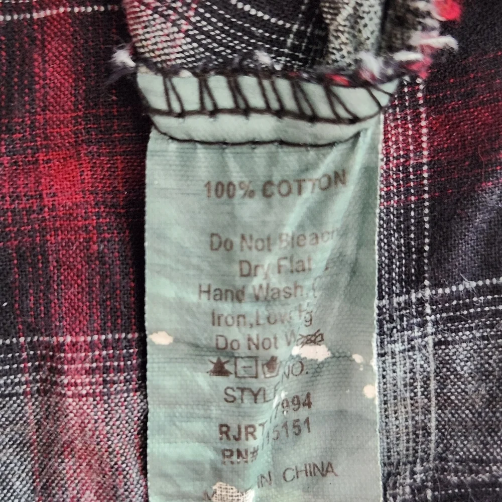 Romeo & Juliet Couture distressed plaid