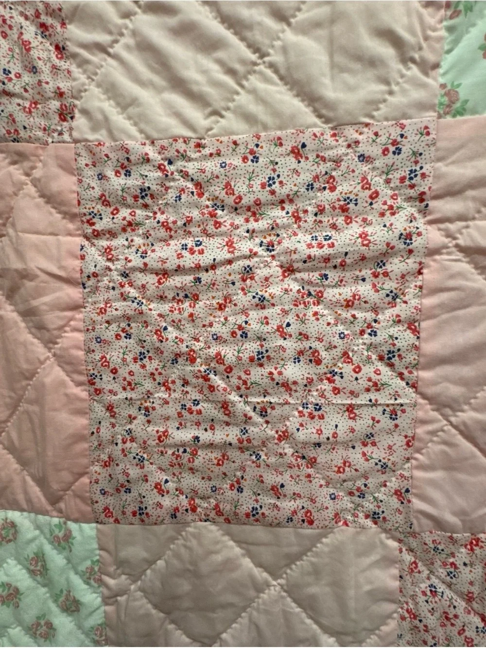 Handmade Pink Patchwork Quilt for your babies crib or toddler bed.