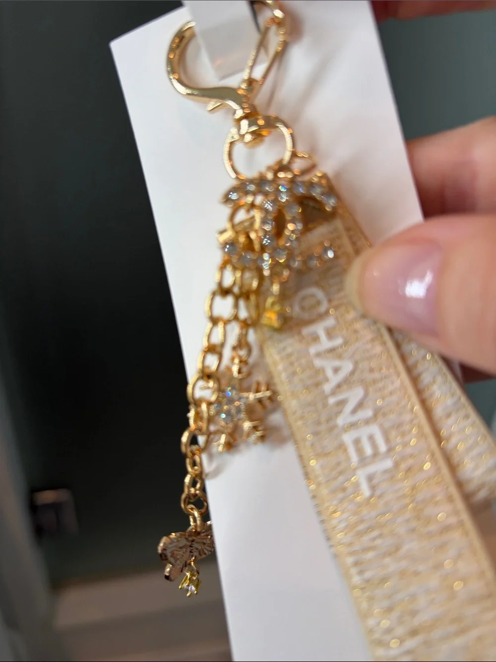 Beige and Gold Logo Strap Keychain with Charms