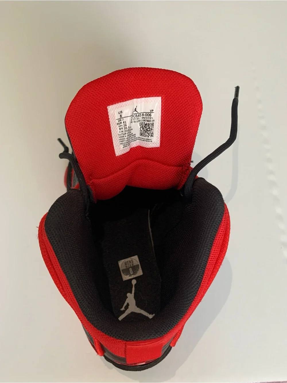 Jordan High-Top Sneakers in Black and Red