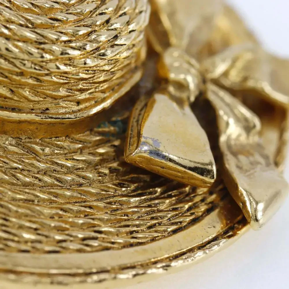 CHANEL gold straw