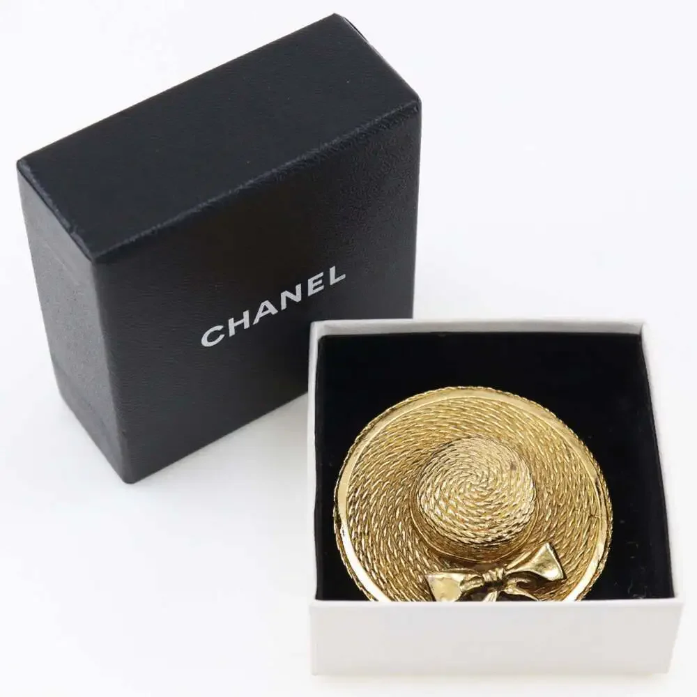 CHANEL gold straw