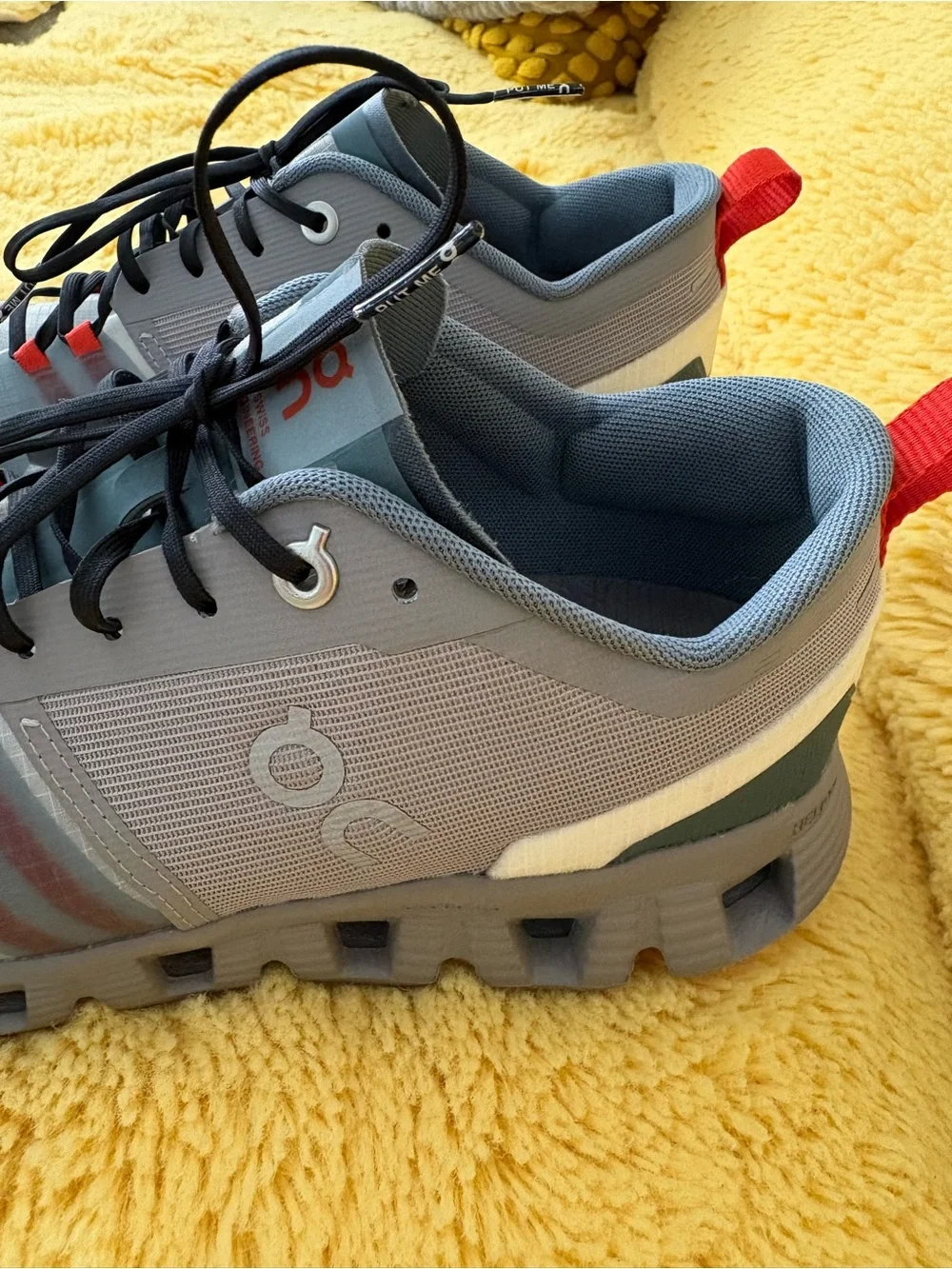 On Running Gray and Red Trail Runners
