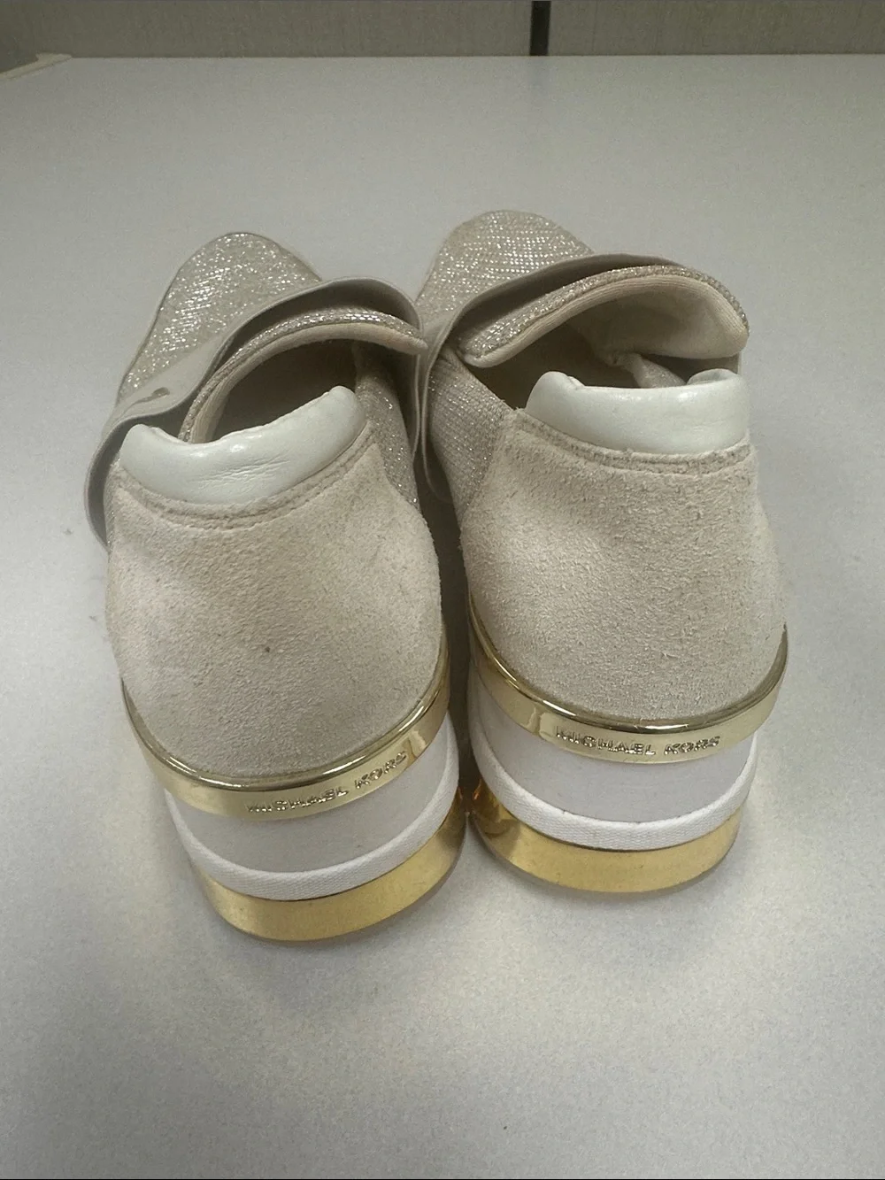 MICHAEL KORS Women’s Size 10 Felix wedge champagne gold slip on fashion sneakers