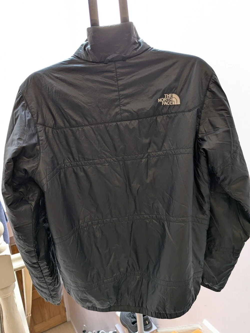 The North Face black jacket face