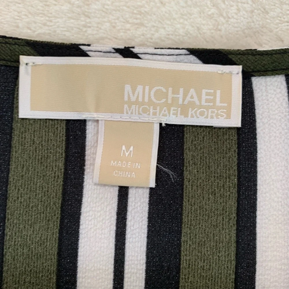 Michael Kors pit can 2%