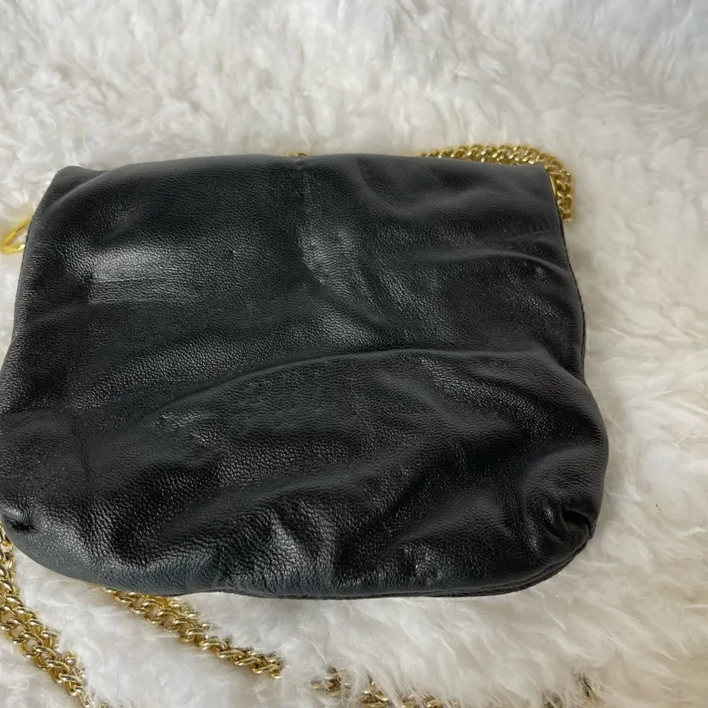 Paradox leather black small crossbody bag with ajustable gold tone chain.