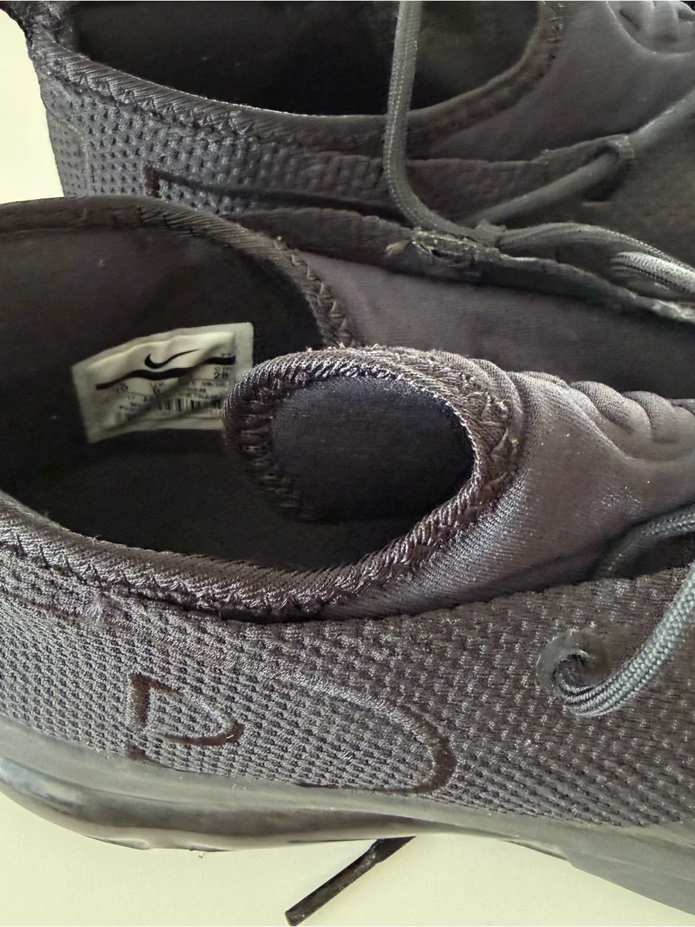 Men's Black Nike Slip-On Sneakers