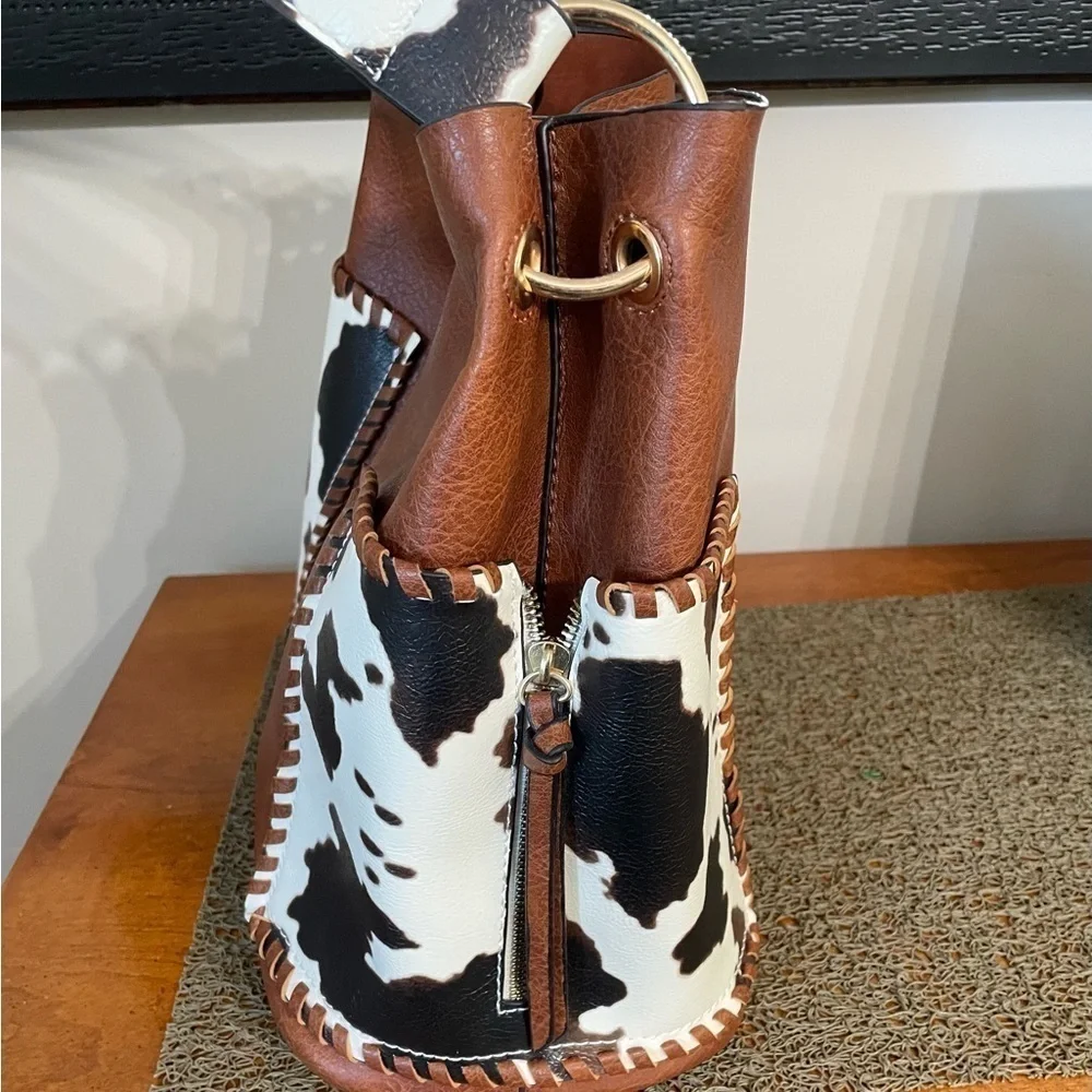 Women’s set of two brown cow print Foux leather cross body, large tote bag/ purs