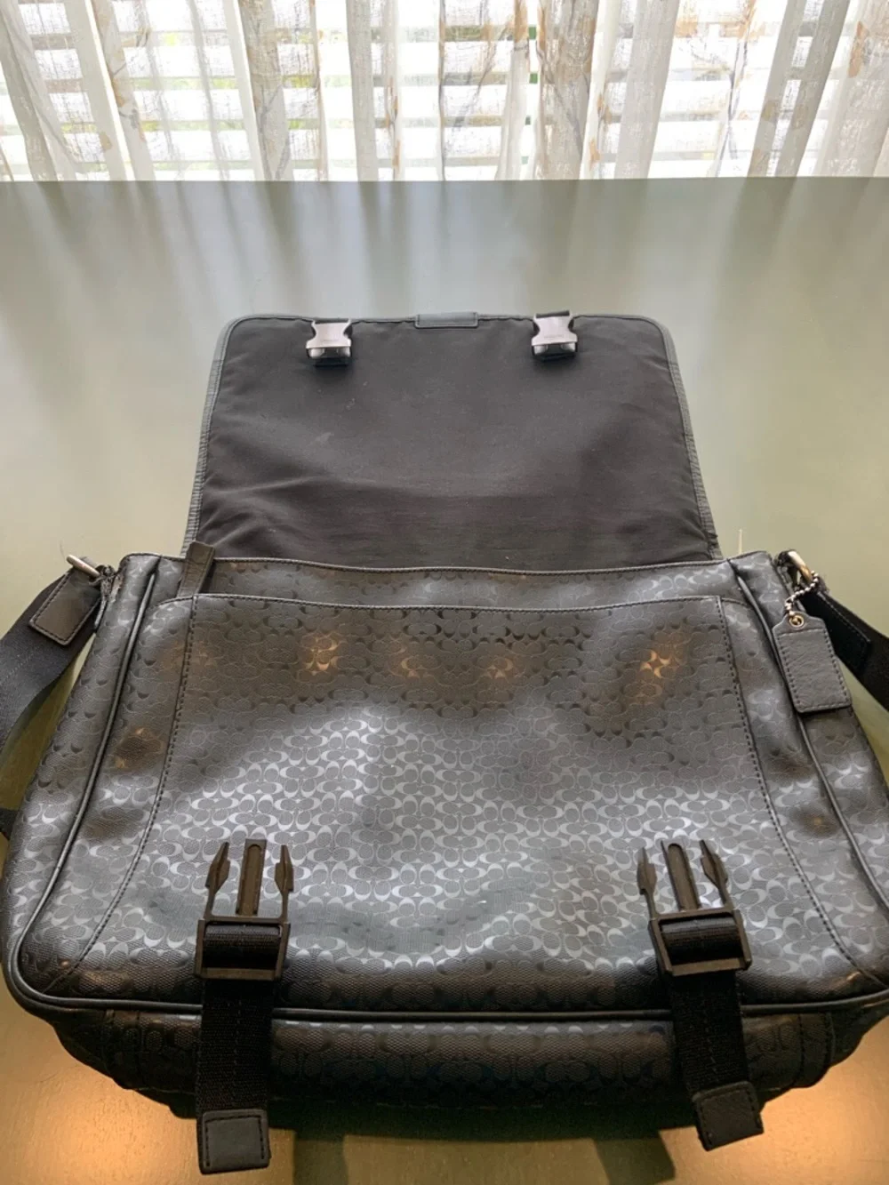 Coach sleek black
