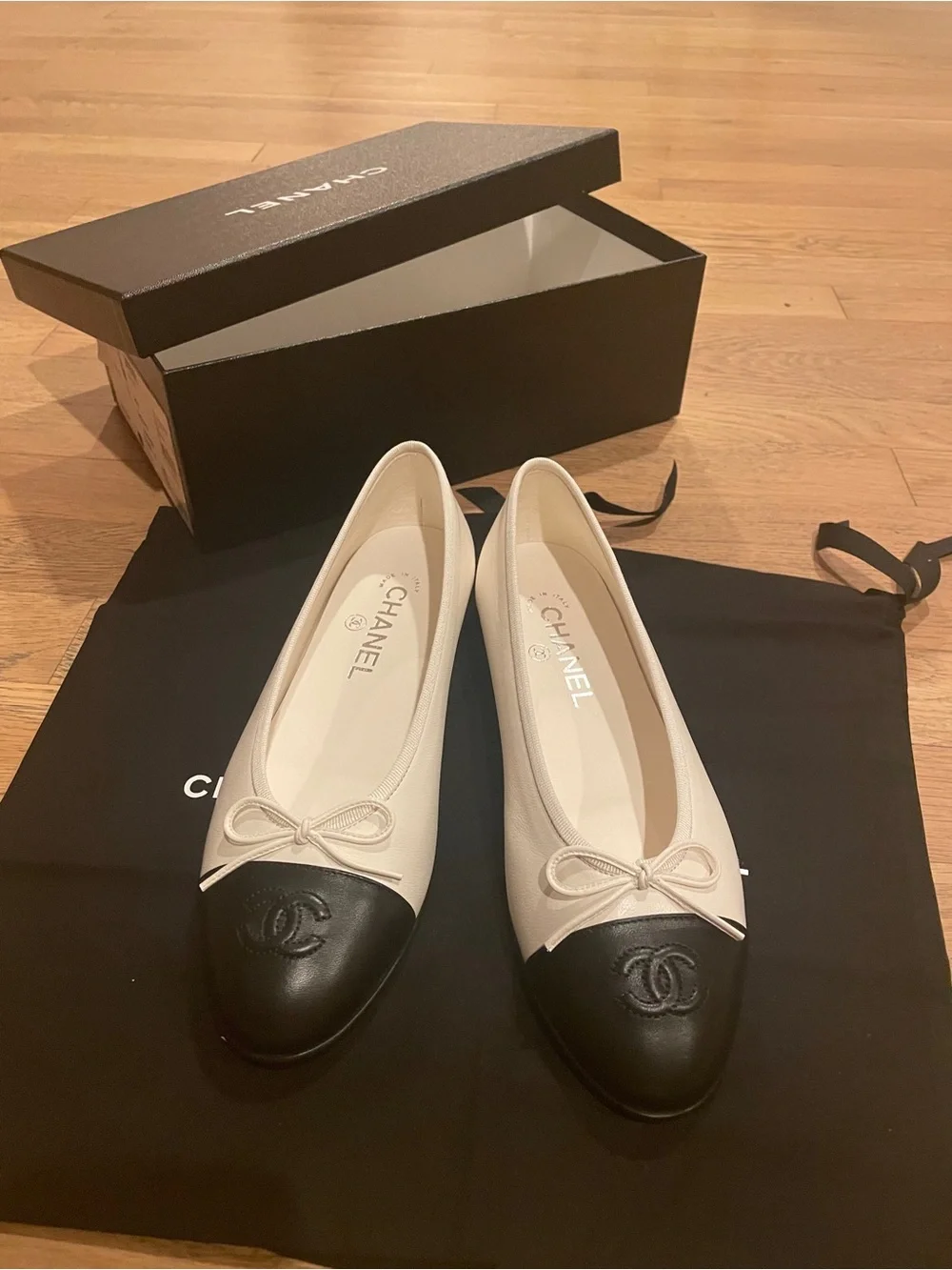 CHANEL Two-Tone Leather Cap-Toe Ballet Flats in Cream and Black
