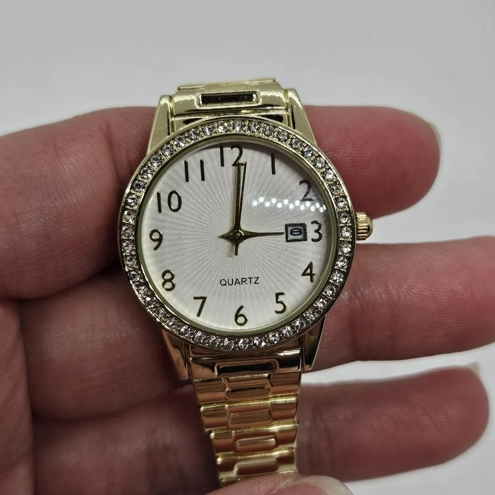gold tone stretch watch with rhinestone case