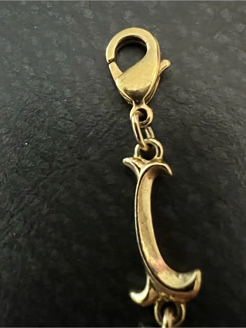 Avon gold tone