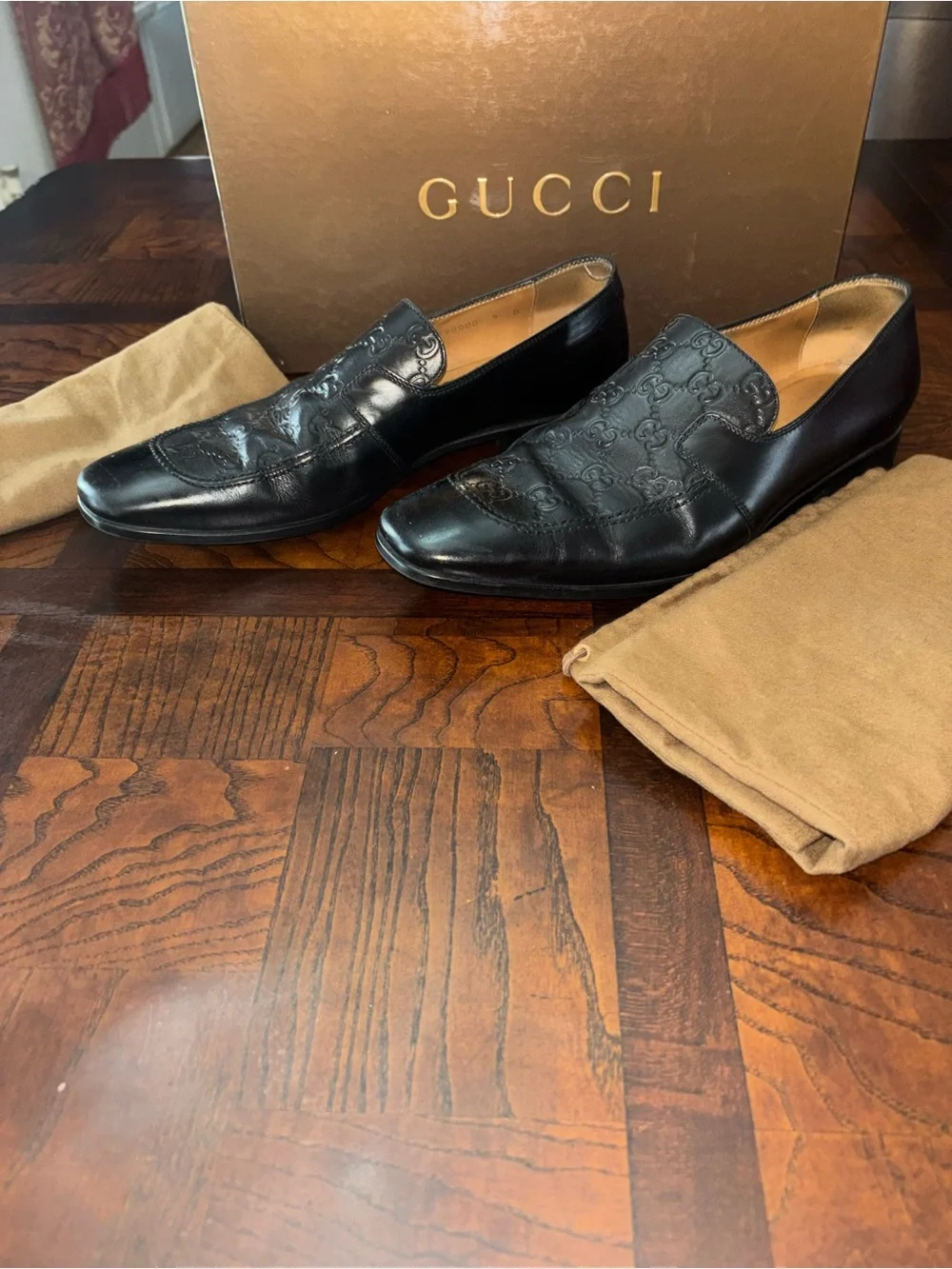 Gucci Black Embossed GG Leather Slip-Ons