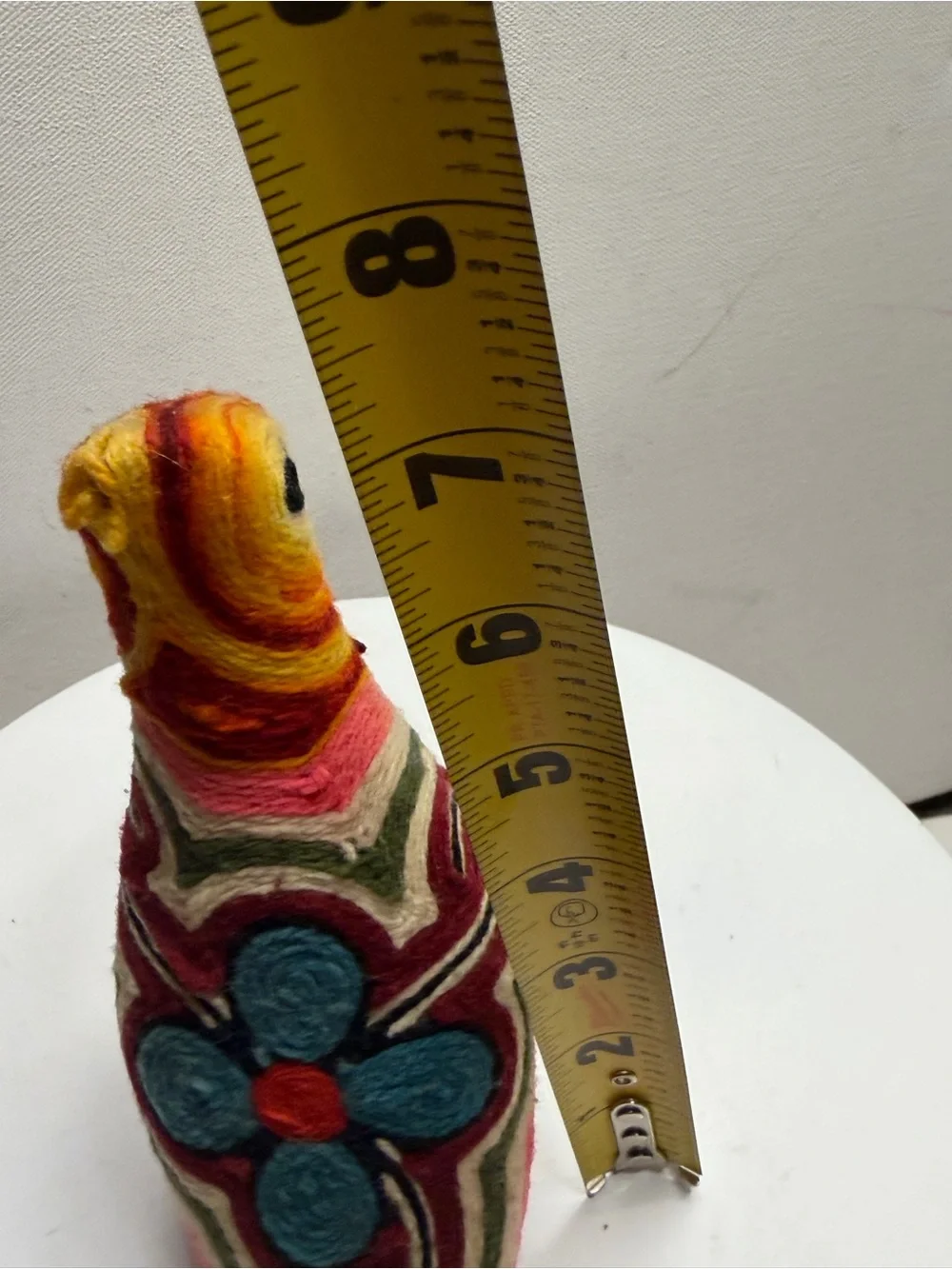 traditional bird figurine in the Huichol yarn art style