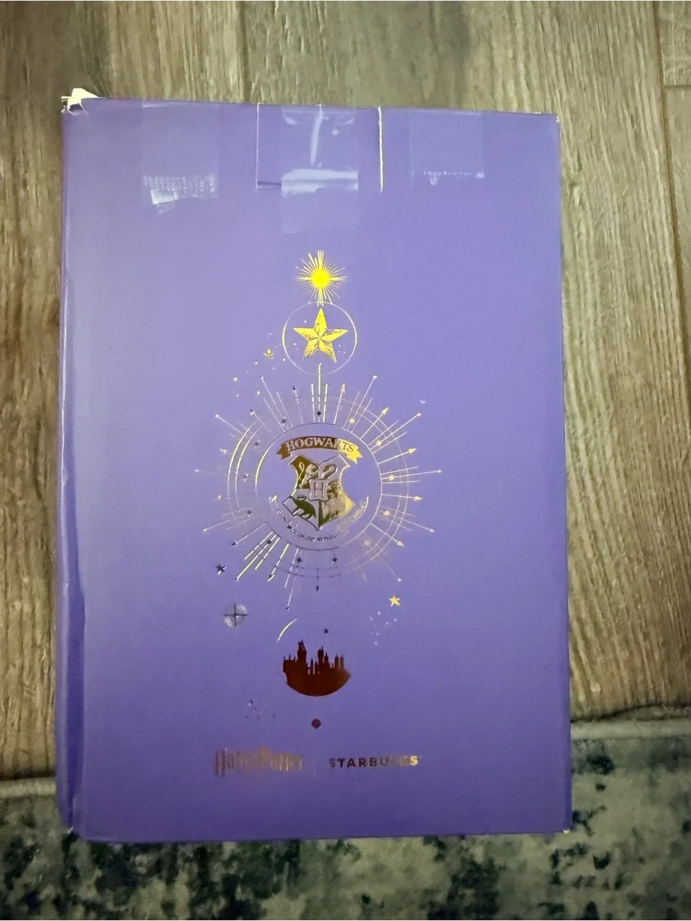 Starbucks Hogwarts Mug with Gold Accents and light on bottom