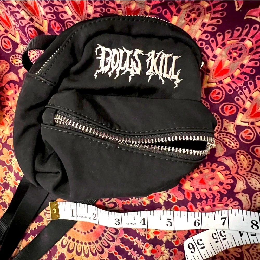 Dolls Kill • Logo Black Mini Backpack with silver exposed zipper, adjustable